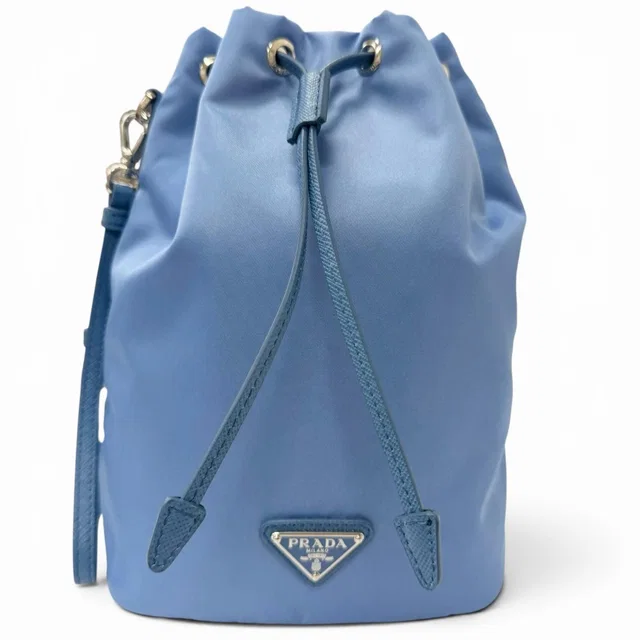 Prada Triangle Logo Re-Nylon Partial Leather Drawstring Bag Handbag Light Blue in Blue Nylon from The Reluxe