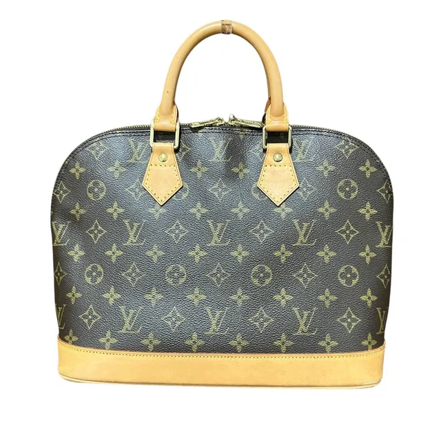 Louis Vuitton Alma Monogram Handbag Canvas in Canvas from The Reluxe