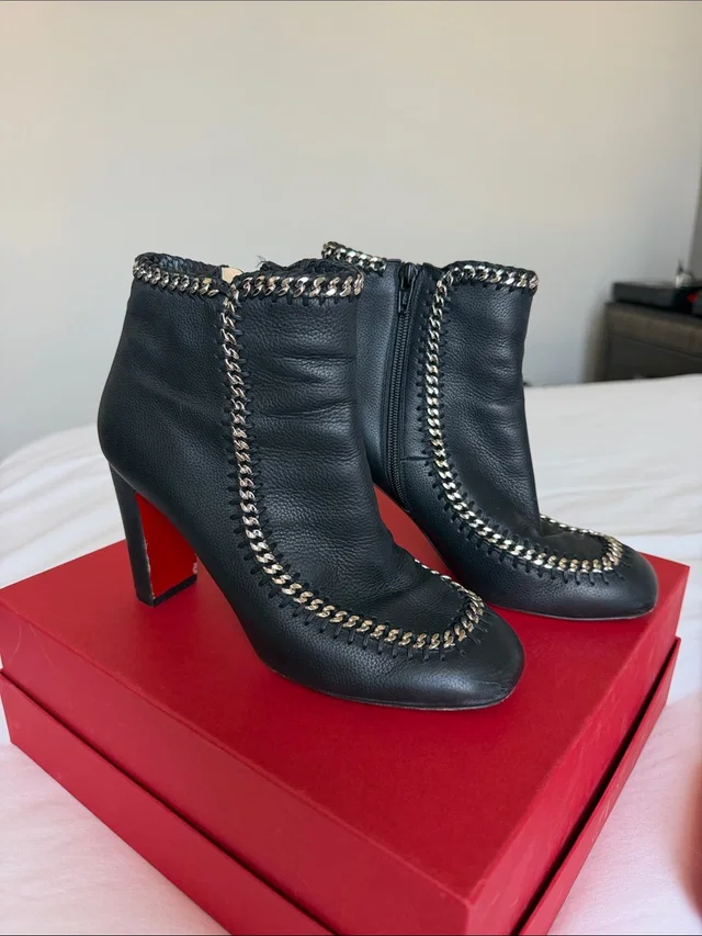Christian Louboutin Black Leather Chain-Trim Ankle Booties With Red Sole in silver|black|gray Leather from Poshmark
