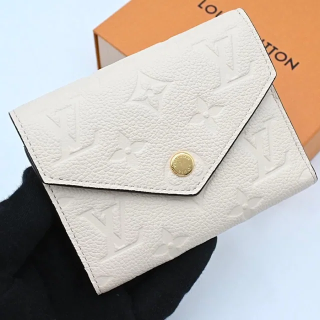 Louis Vuitton Empreinte Portefeuille Victorine White Wallet in White Leather from The Reluxe