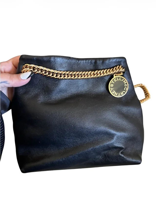 Stella McCartney Black Clutch With Gold Chain And Logo Disc in black|gold Leather from Poshmark