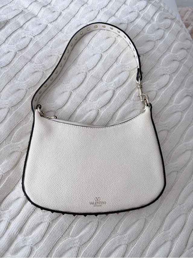 Valentino Garavani Pebbled Leather Shoulder Bag With Black Trim in white Leather from Poshmark, photo 1 of 1