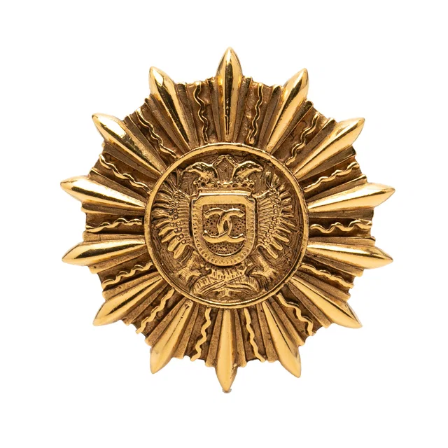 Gold Chanel Gold Plated Sunburst Shield Brooch in Gold from Designer Revival