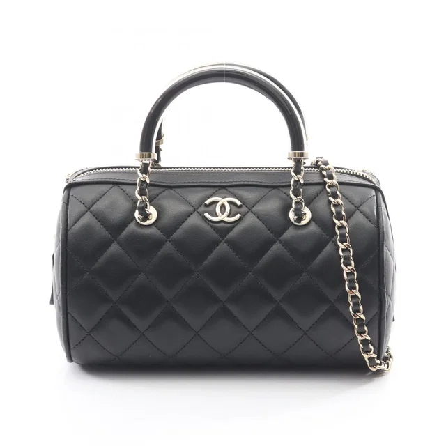 Chanel Quilted 2-Way Black Lambskin Mini Boston Bag in Black Lambskin from The Reluxe