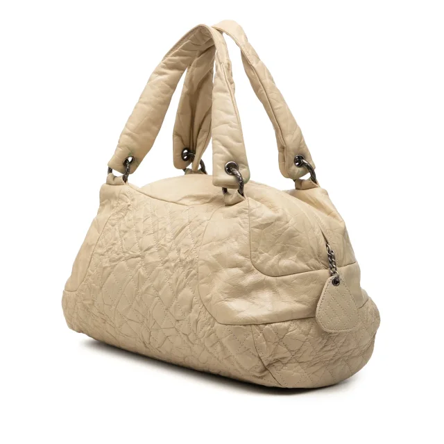 Beige Chanel CC Quilted Aged Calfskin Coco Rider Bowling Bag in Beige Calfskin from Designer Revival, photo 2 of 11
