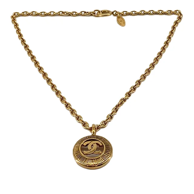 Gold Chanel CC Gold Plated Medallion Sunburst Pendant Necklace in Gold from Designer Revival, photo 1 of 1