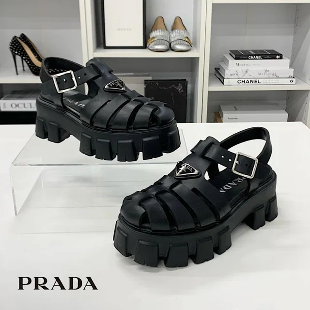 Prada Monolith Rubber Triangle Logo Sandals Black in Black from The Reluxe