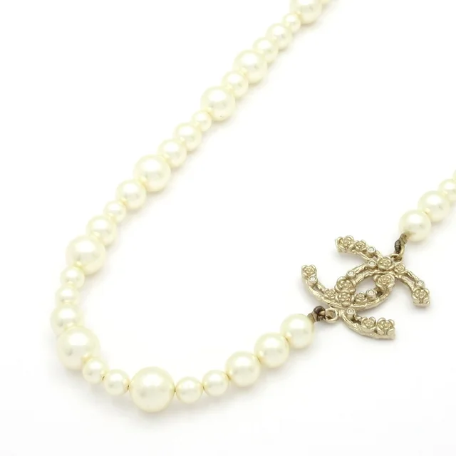 Chanel Necklace CC Logo Ivory Gold Clear Camellia in White from The Reluxe