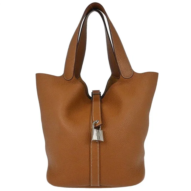 Hermès Gold Taurillon Clemence Picotin Lock 26 GM Handbag in Gold Clemence leather from AMORE Vintage Tokyo