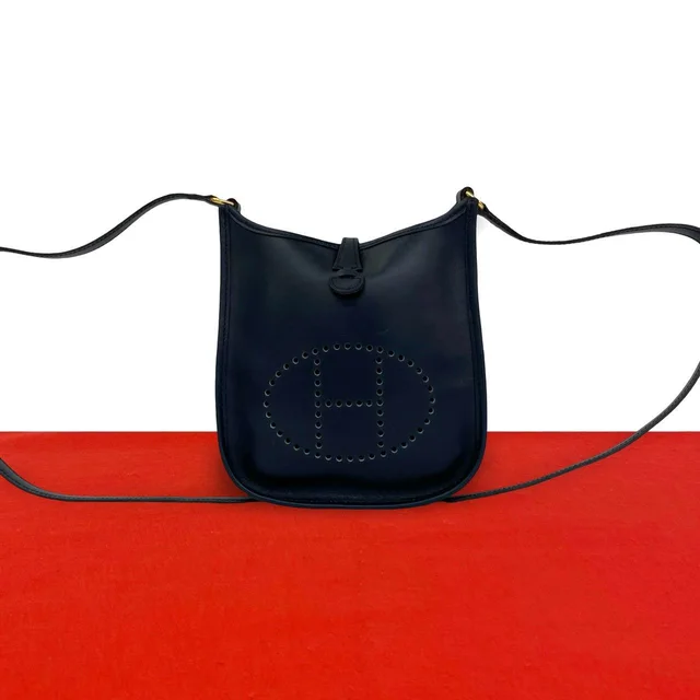 Hermès Evelyne TPM Box Calf Shoulder Bag Pochette Blue Deplus Navy in Navy Box leather from The Reluxe