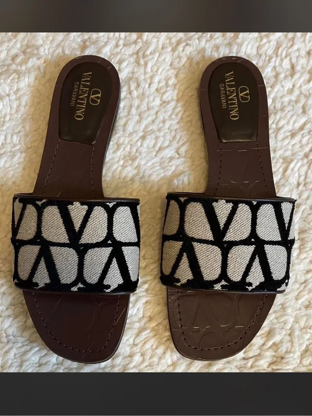 Valentino Garavani Black & Cream Logo Jacquard Slide Sandals in black|white Leather from Poshmark, photo 1 of 1