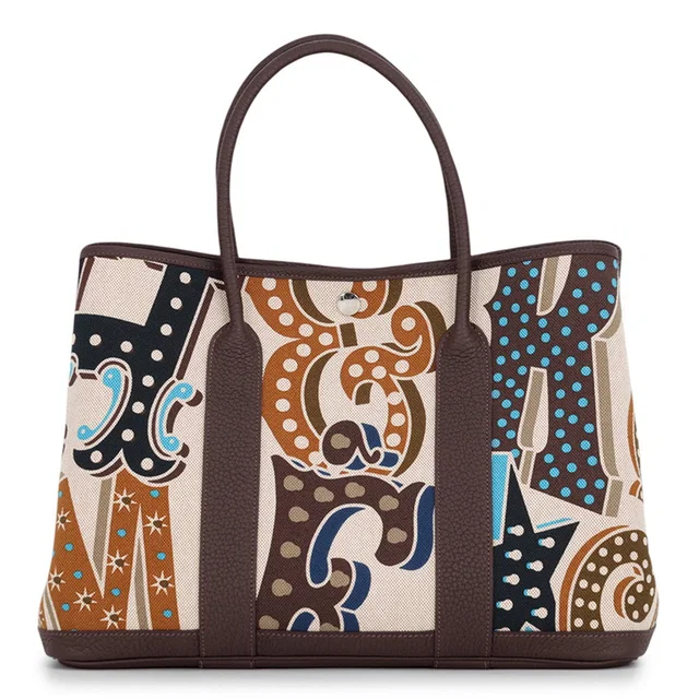Hermès Garden Party Electric Caramel/Ecru/Beige/Ebene Toile H Negonda Leather Size PM in Brown Leather from GALLERY RARE