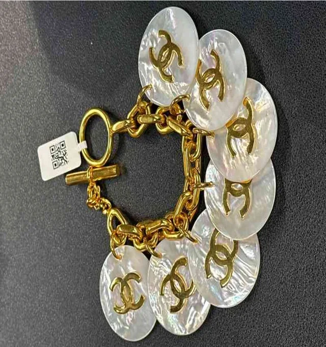 Chanel white mother-of-pearl bracelet with simple logo in White from Luxury Promise