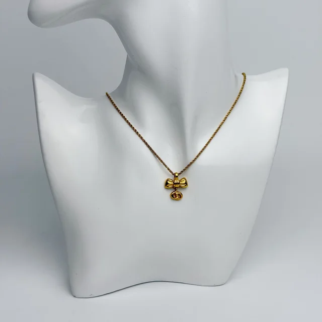 Dior Ribbon CD Logo Necklace Plated Gold Vintage in Gold from The Reluxe
