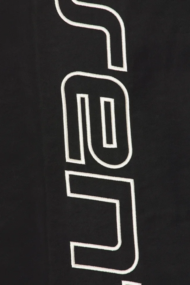 Fear of God ESSENTIALS Active Trace Relaxed Drawstring Pant in Vintage Black, photo 7 of 7 from REVOLVE (Canada)