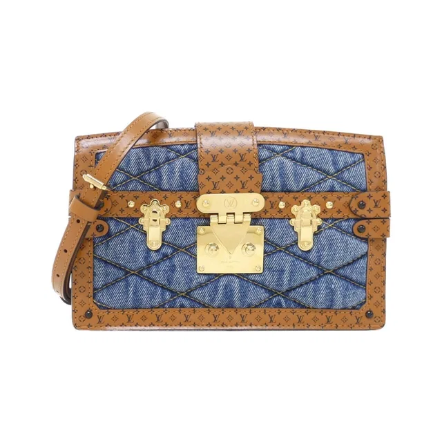 Louis Vuitton Monogram Trunk Clutch in Canvas from The Reluxe