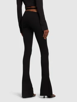 The Attico Flare pants with belt in 68% Viscose, 27% Polyamide, 5% Elastane, photo 3 of 5 from LUISAVIAROMA