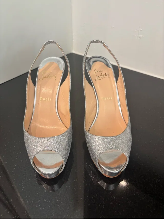 Christian Louboutin Silver Glitter Peep-Toe Slingback Pumps in gray|silver from Poshmark