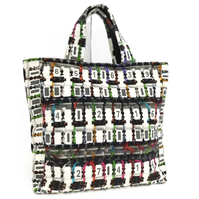 Chanel Beach Bag Pile from The Reluxe