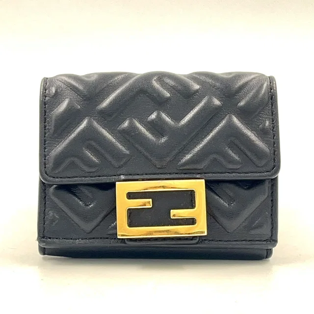 Fendi Baguette Micro FF Embossed Nappa Leather Black Trifold Wallet Gold in Black Nappa leather from The Reluxe