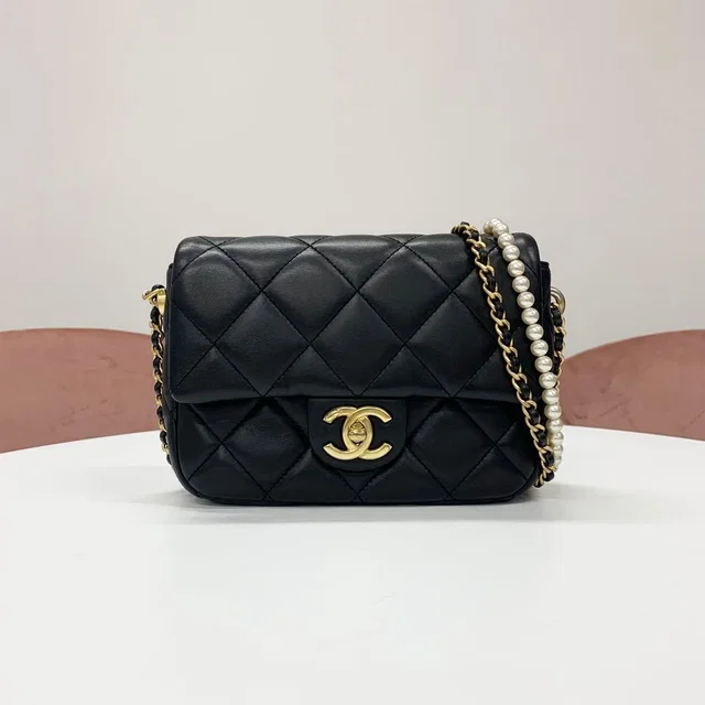 Chanel Mini Quilted CC Logo Lambskin Turnlock Shoulder Bag in Lambskin from The Reluxe