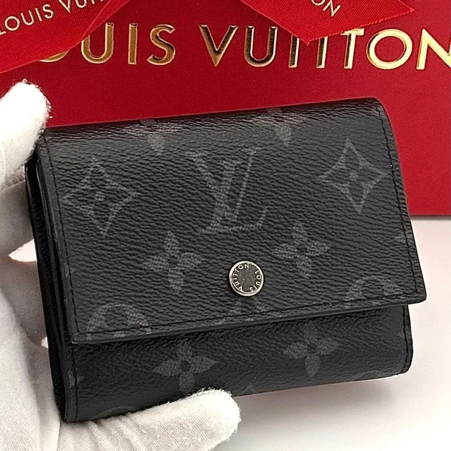 Louis Vuitton Wallet Monogram Eclipse Victor from The Reluxe