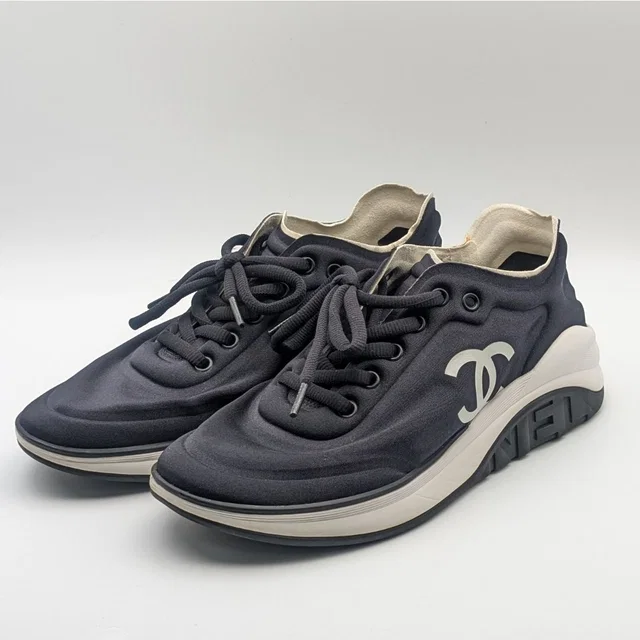 Chanel Sneakers CC Logo Black White Fabric Shoes in Black from The Reluxe
