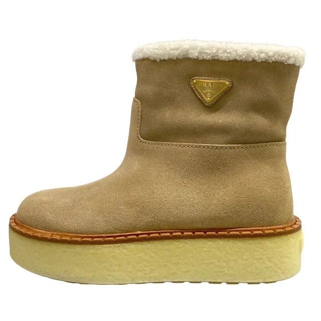 Prada Short Boots Beige Shearling in Beige from The Reluxe