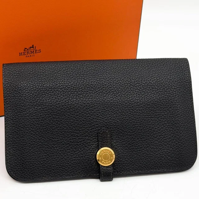 Hermès Dogon GM Duo Taurillon Clemence Gold Togo Wallet in Gold Togo leather from The Reluxe