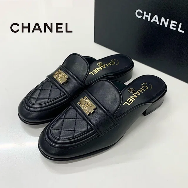 Chanel CC Logo Lambskin Quilted Boy Mules in Lambskin from The Reluxe