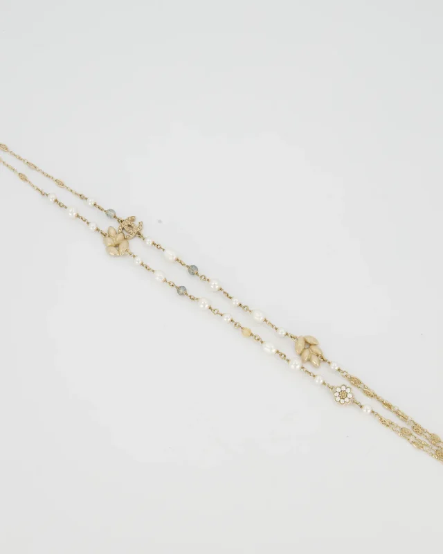 Chanel Long Choker and Necklace with Leaf, Daisy, and Pearl Embellishments and Crystal CC Logo Detail in Gold from Sellier, photo 2 of 3