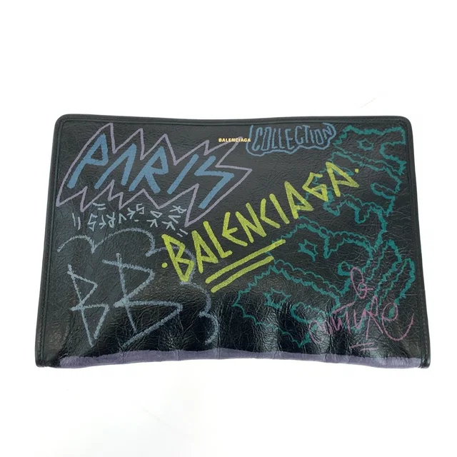 Balenciaga Graffiti Print Leather Clutch Bag in Leather from LuxUness