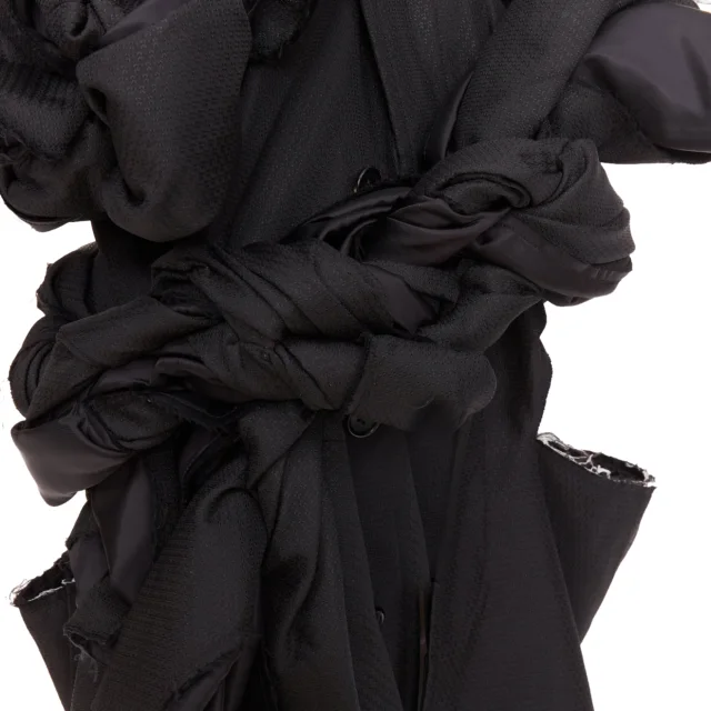 Comme des Garcons black textured 3D multi knots cut out coat in black, photo 2 of 6 from ShopSimon