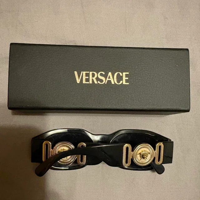 Versace Women's Sunglasses - Black in black from Depop, photo 3 of 4