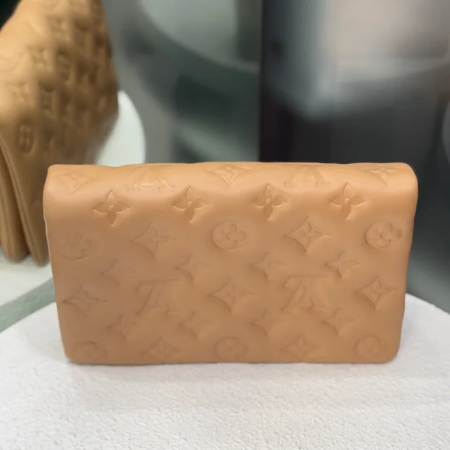 Louis Vuitton Pochette Coussin Clutch - Camel in Brown Lambskin from Revivre Luxury Consignment