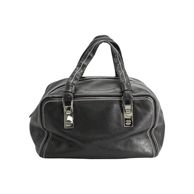 Chanel Boston Bag Travel Bags Black in Black Lambskin from The Reluxe