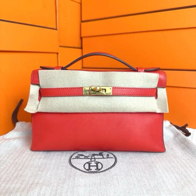 Hermès Kelly Pochette Rouge Tomate Swift GHW #X in Red Swift leather from Luxury Promise