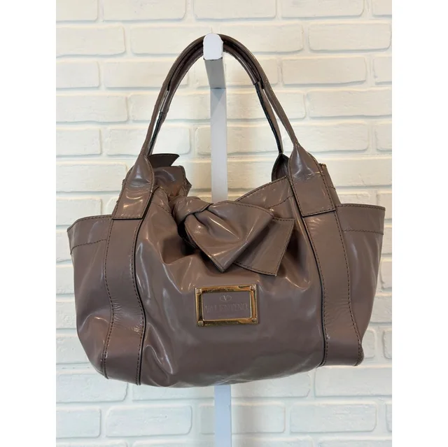 Valentino Garavani Bow Tote Taupe Patent Leather Shoulder Bag in gold Patent leather from Poshmark