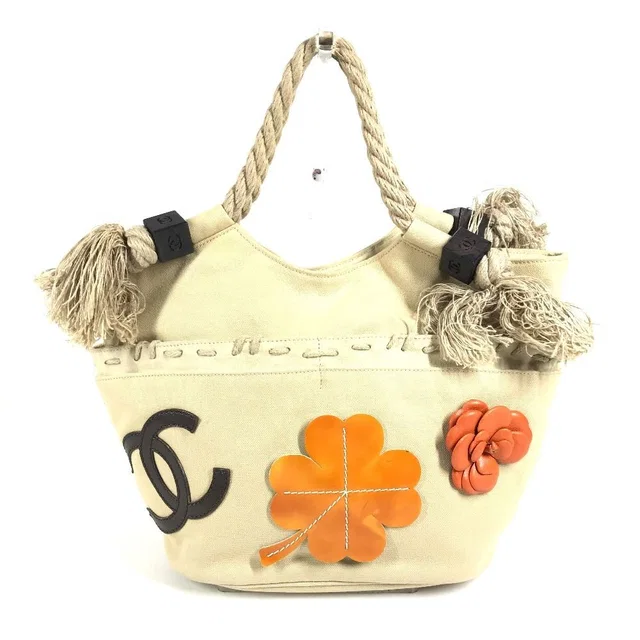 Chanel Handbag CC Logo Jumbo Canvas Beige in Beige Canvas from The Reluxe