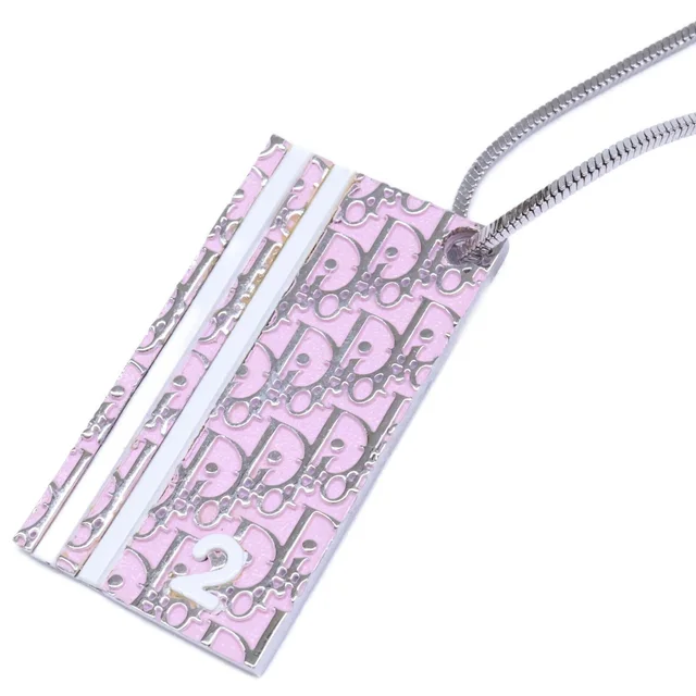 Dior Trotter Plate Necklace Pink in Pink from The Reluxe