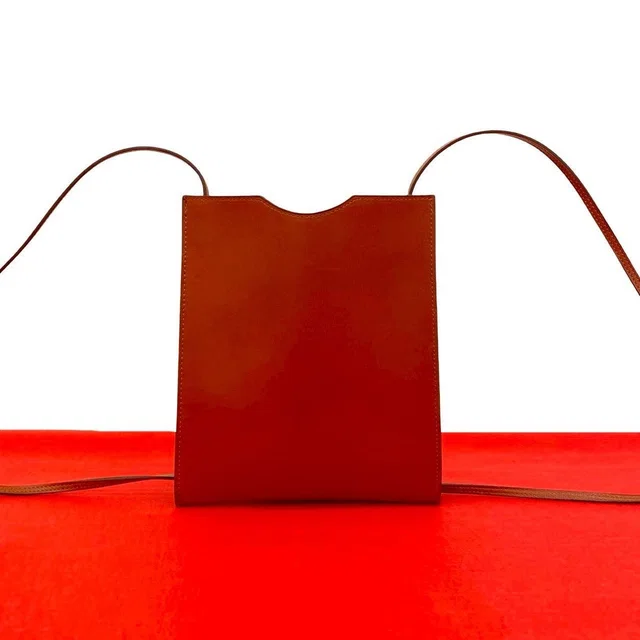 Hermès Vintage Box Calf Leather Mini Shoulder Bag Pochette in Box leather from The Reluxe