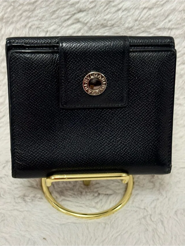 Bvlgari Black Leather Wallet With Silver-Tone Accent in gold|black Leather from Poshmark, photo 1 of 1