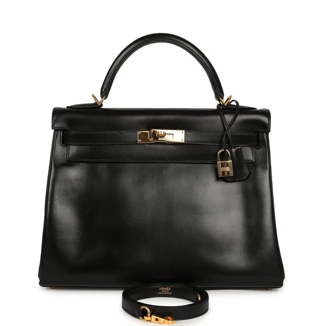 Hermès Vintage Kelly Retourne 32 Black Box Gold Hardware in Black Calfskin from Madison Avenue Couture