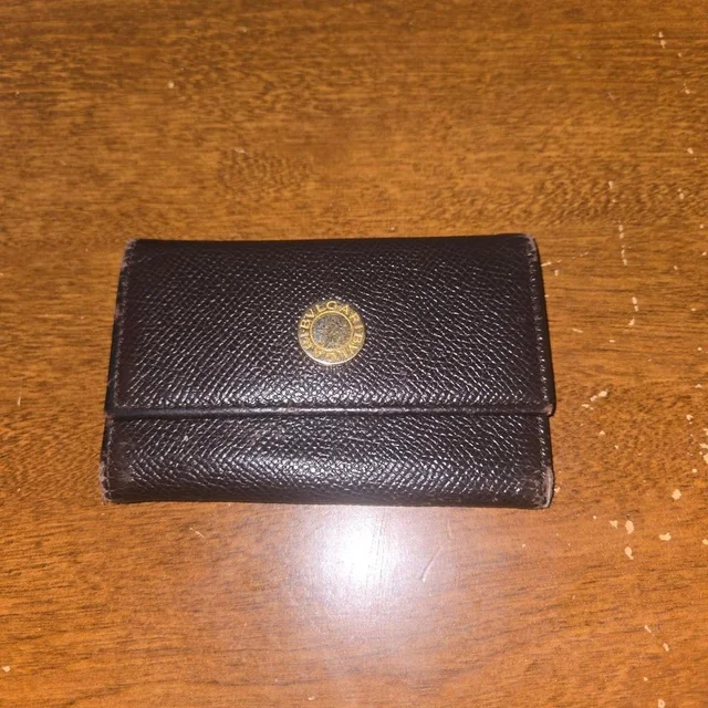 Bvlgari Women's Wallet - Brown/Black in red|black|brown from Depop, photo 1 of 1
