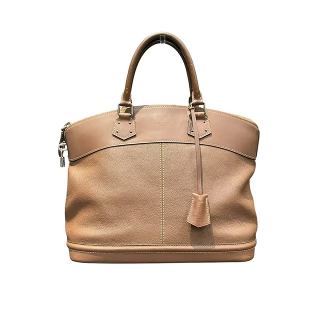 Louis Vuitton Rock It MM Suhali Handbag Goatskin in Goatskin from The Reluxe