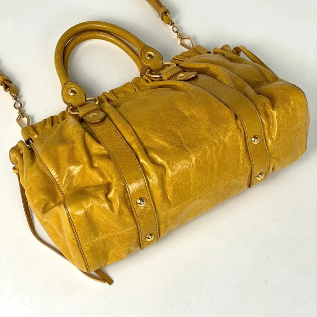 Miu Miu Shoulder Handbag Leather Logo Bag Yellow in yellow Leather from Poshmark