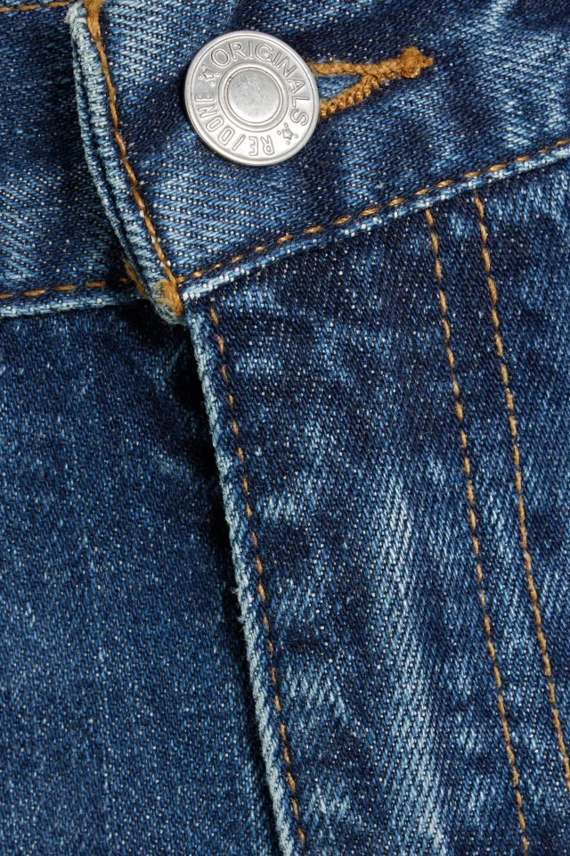 Re/Done Mid-Rise Flared Jeans in Mid denim, photo 4 of 4 from THE OUTNET