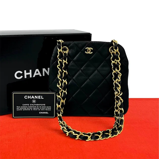 Chanel Vintage Quilted Coco Lambskin Kiss Lock Shoulder Bag Black in Black Lambskin from The Reluxe