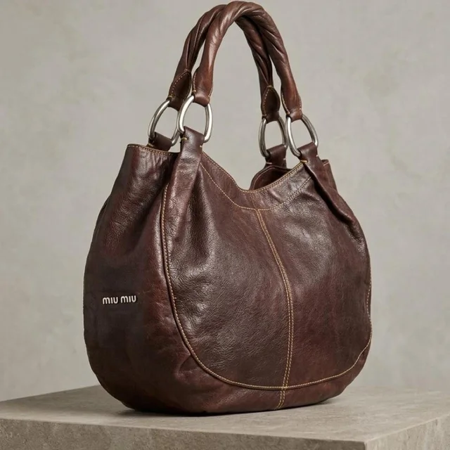 Miu Miu Women's Shoulder bags - Brown in red|brown from Depop, photo 1 of 1