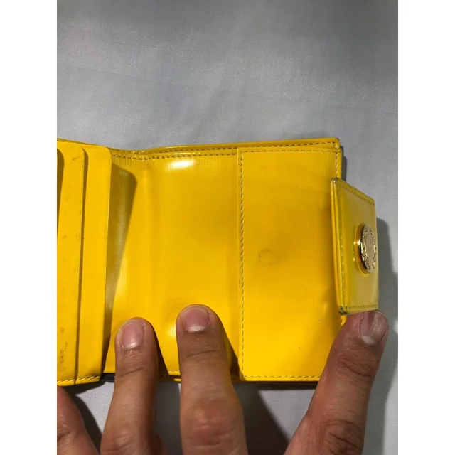 Bvlgari Women's Wallets - Black/Yellow in yellow|black from Depop, photo 6 of 9